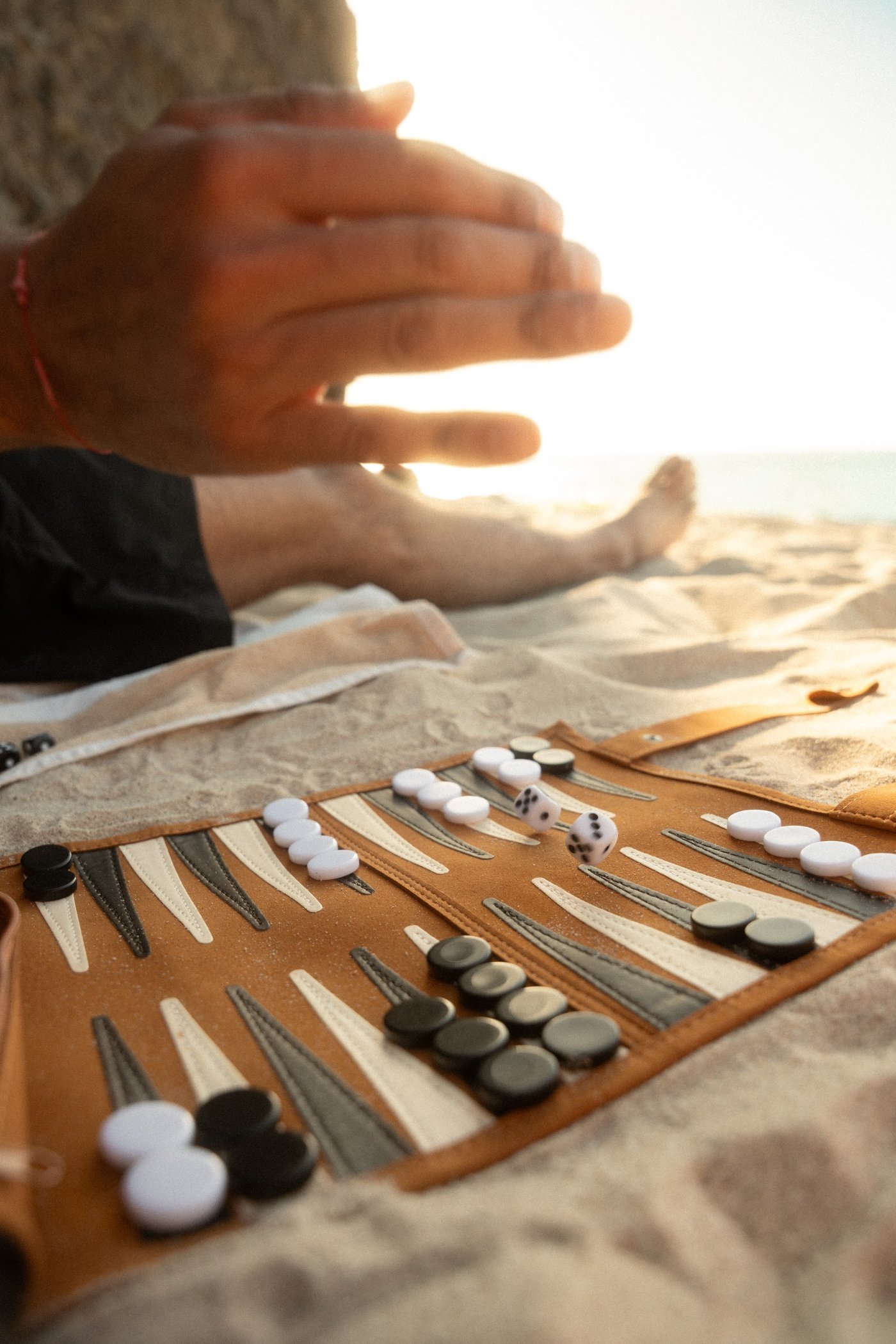A game of backgammon in the sand