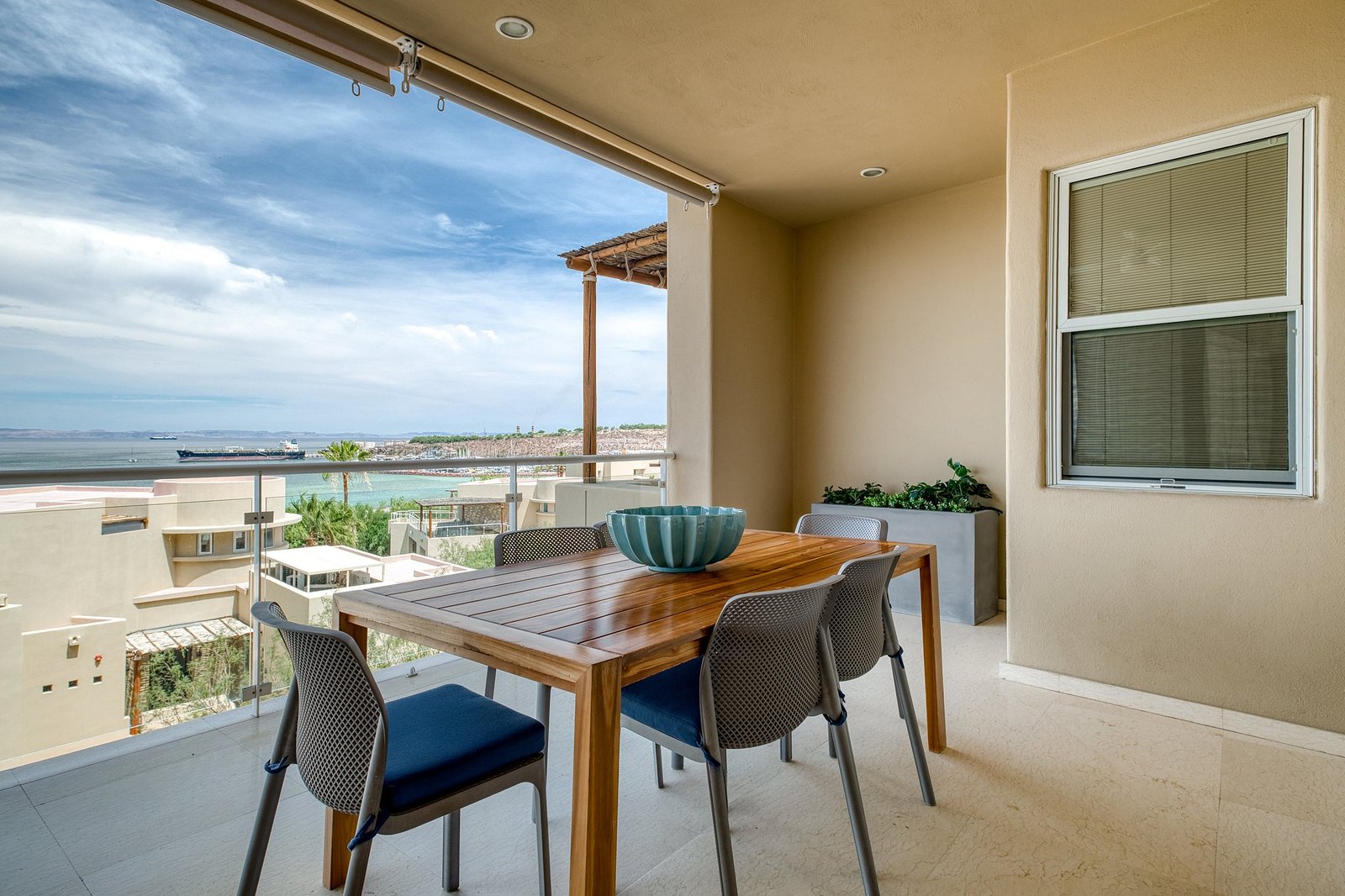 Terrace dining with views of the bay